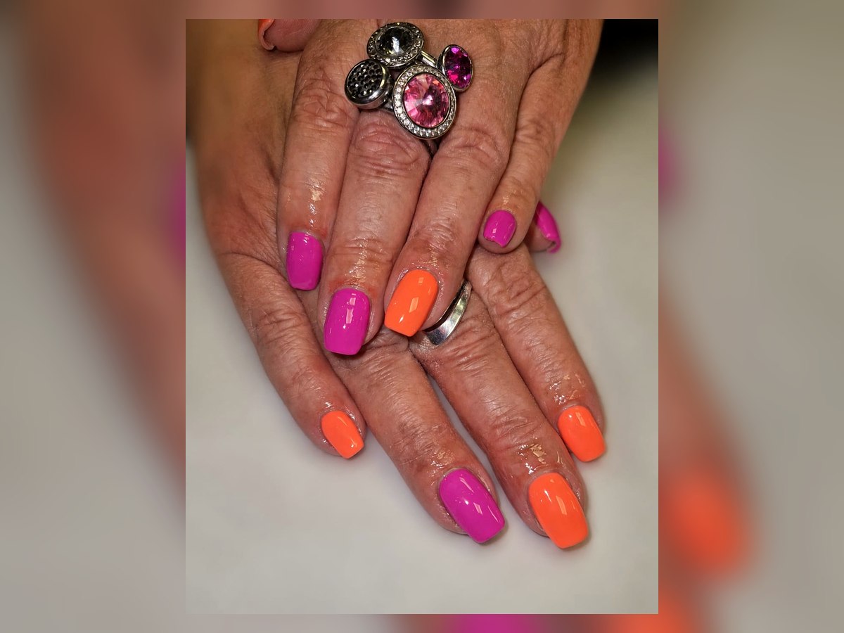 Pink and orange BIAB nails by LM Beauty in Kilmarnock